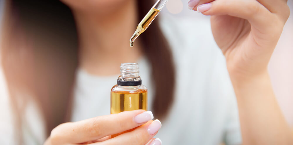 Woman using hemp seed oil