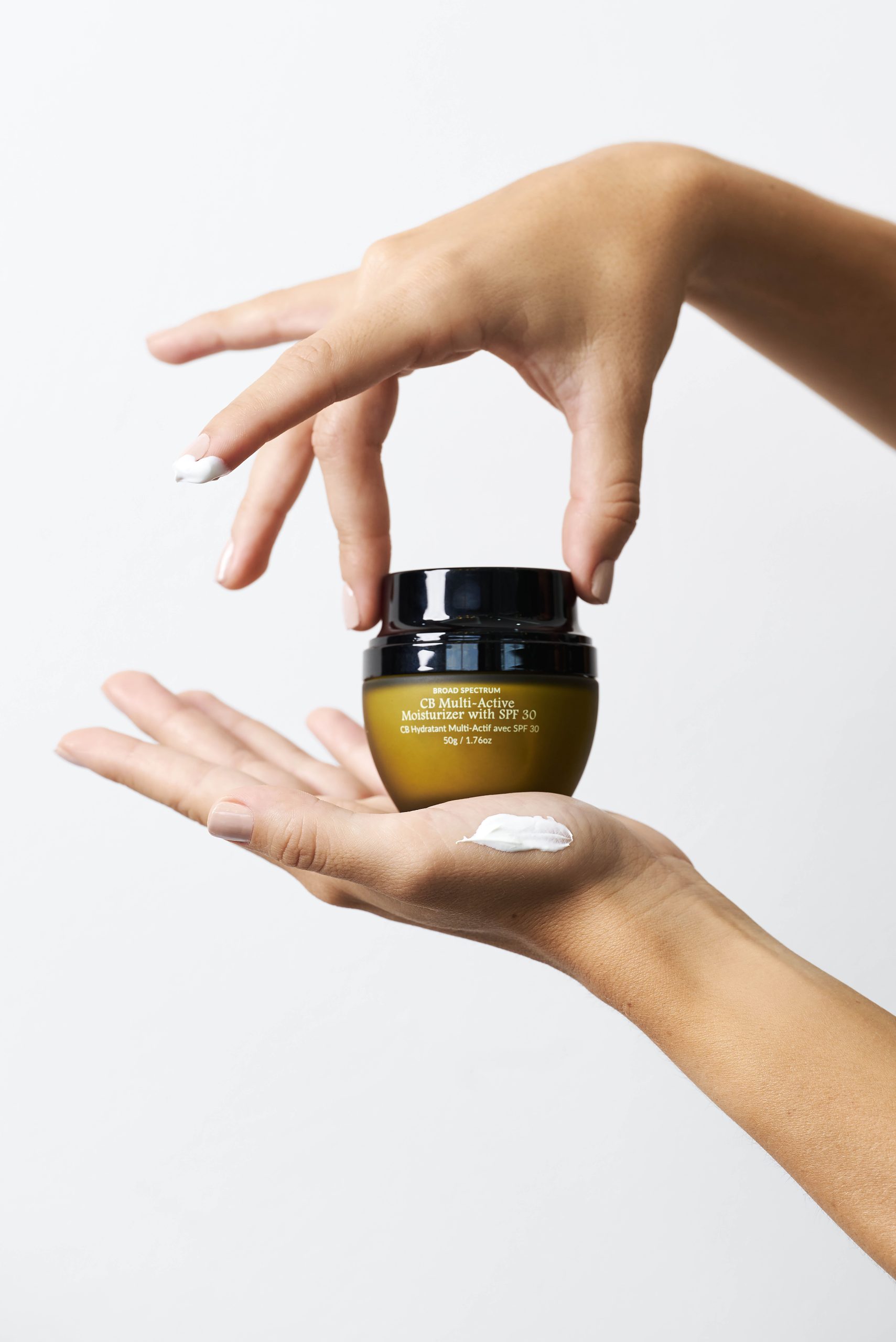 Person using the CbGardn SPF Moisturizer