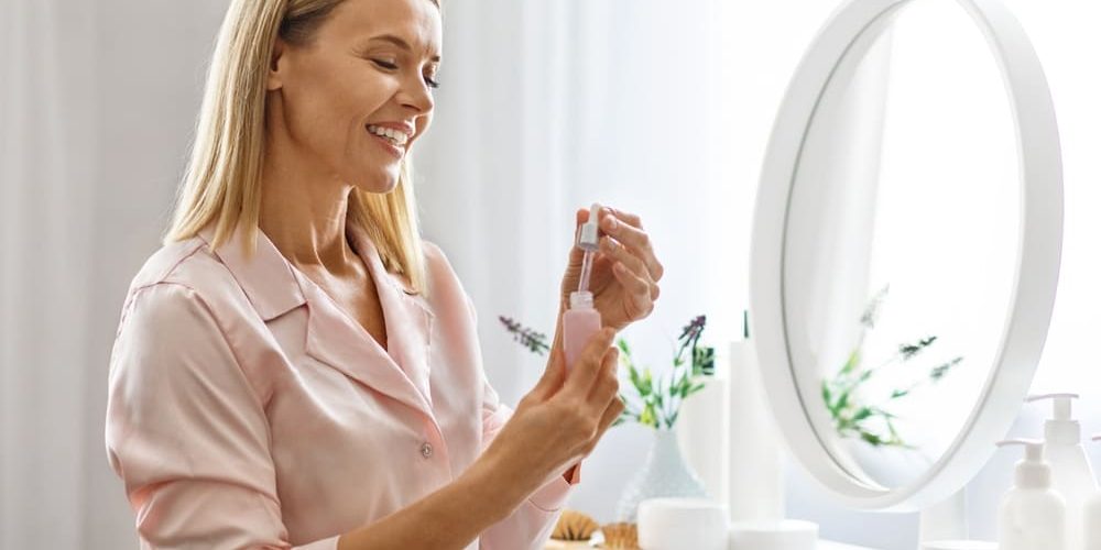 Woman using peptide skincare product for wrinkles